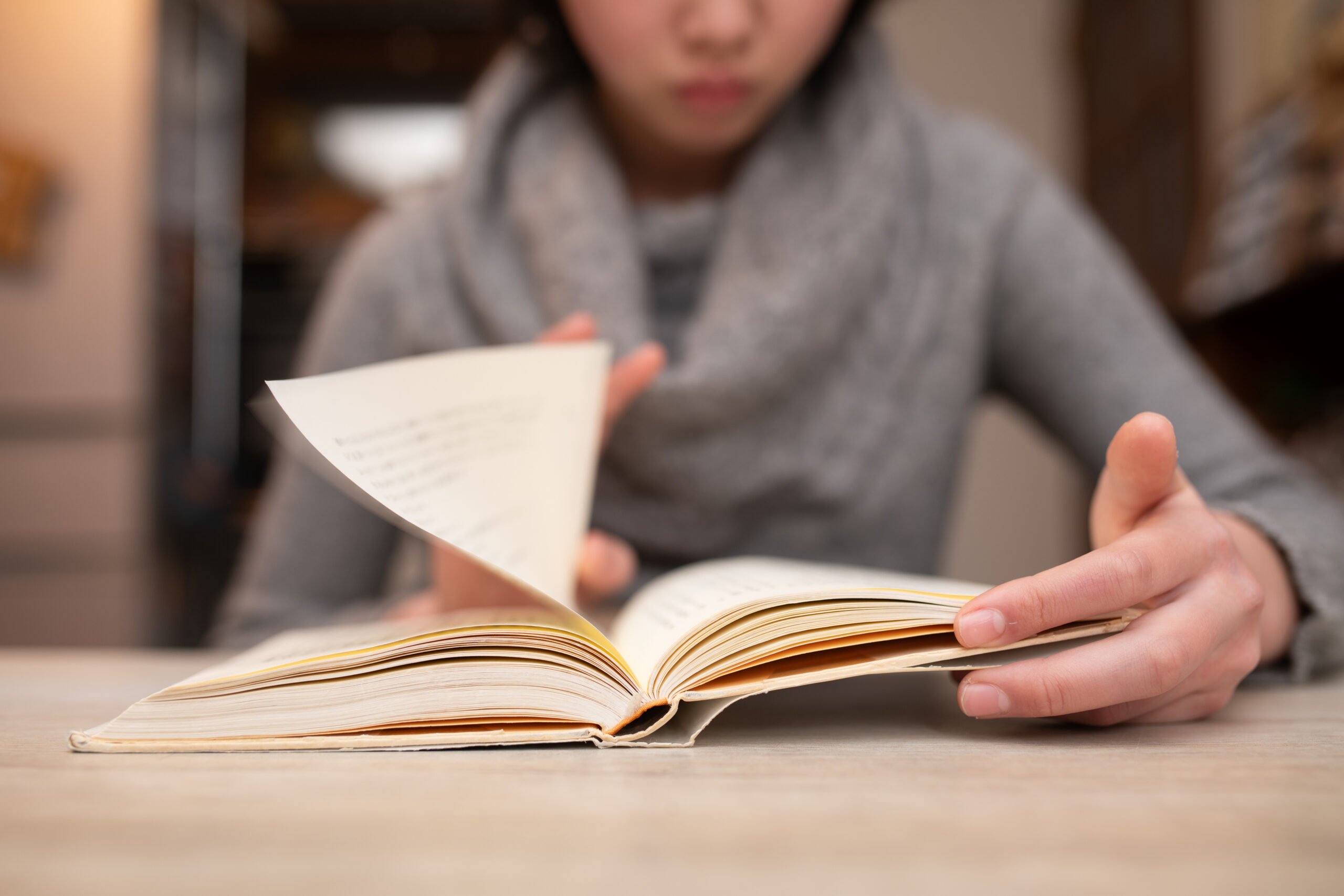 Young person reading a book